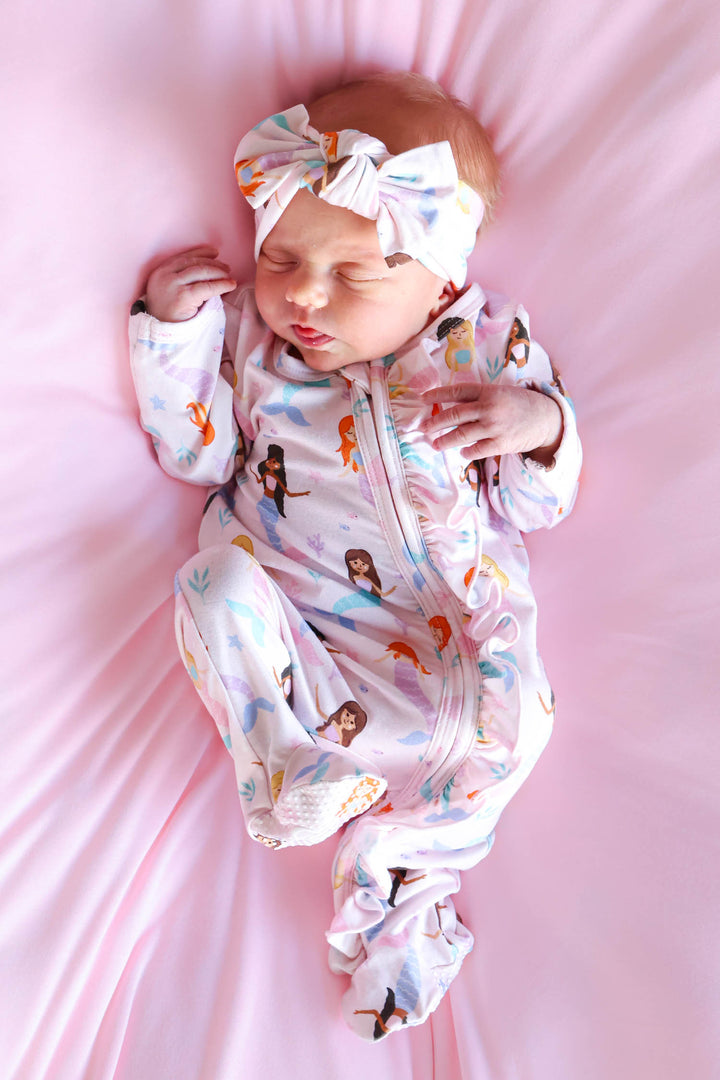 baby girl wearing let's be mermaids knit bow headwrap, lifestyle