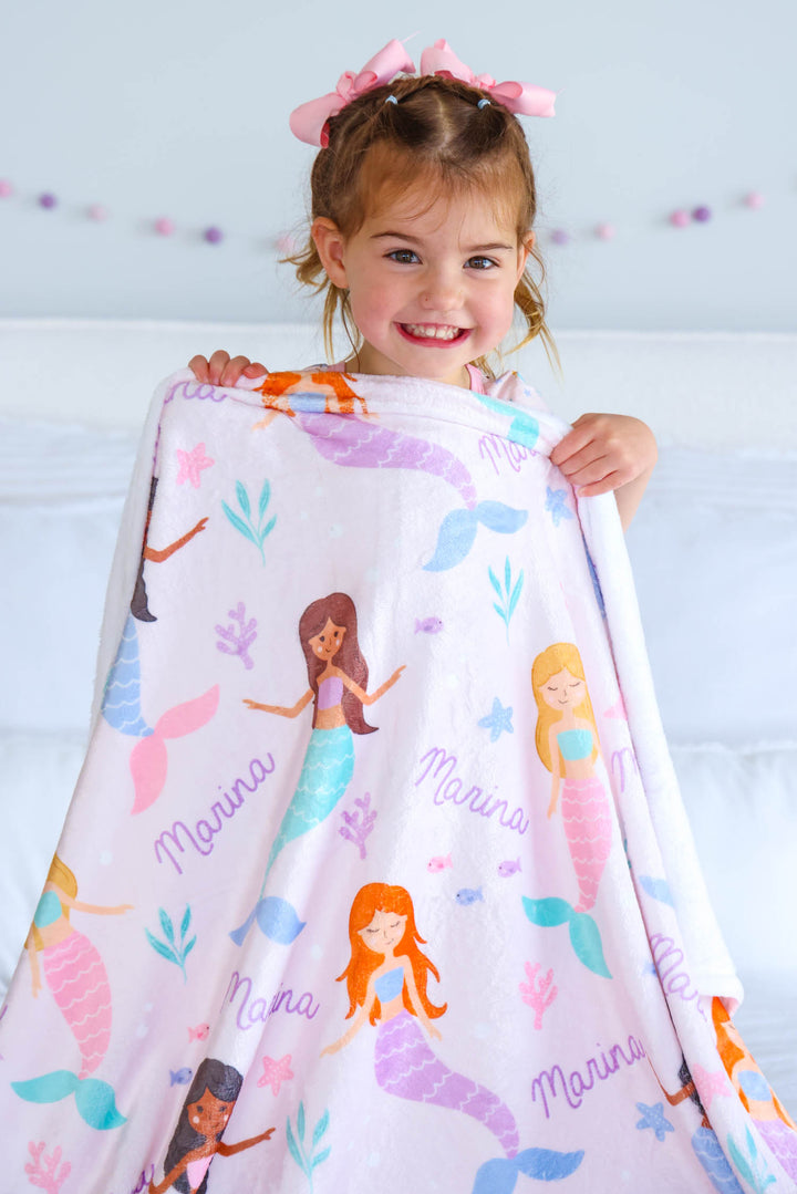 personalized mermaid kids blanket flat lay showing custom name placement