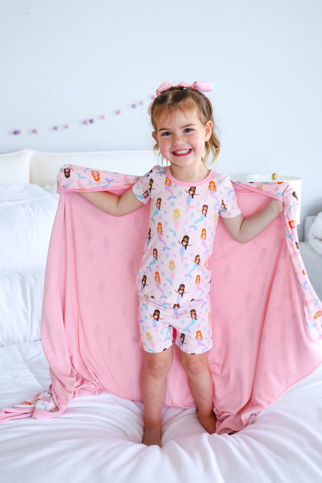 let's be mermaids bamboo blanket flat lay showing mermaid print