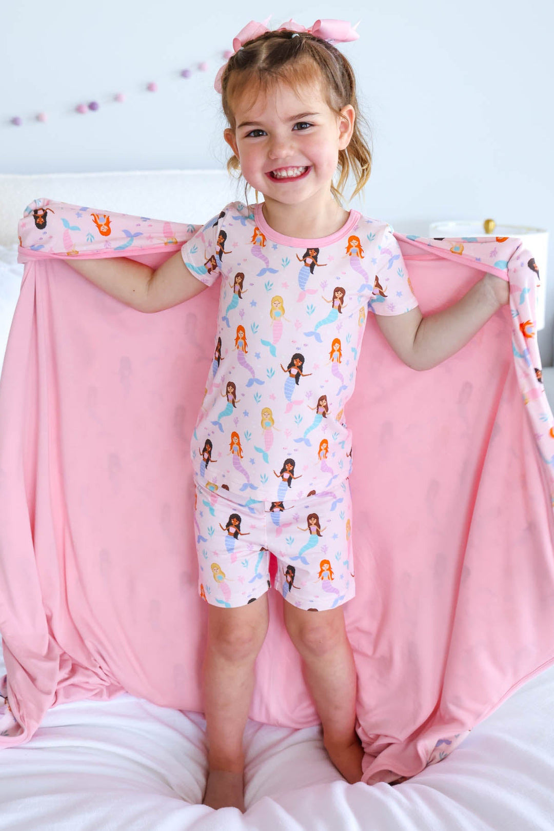 let's be mermaids bamboo blanket flat lay showing mermaid print