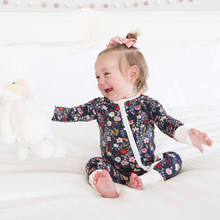 pink, red and white floral on navy pajama romper for toddlers