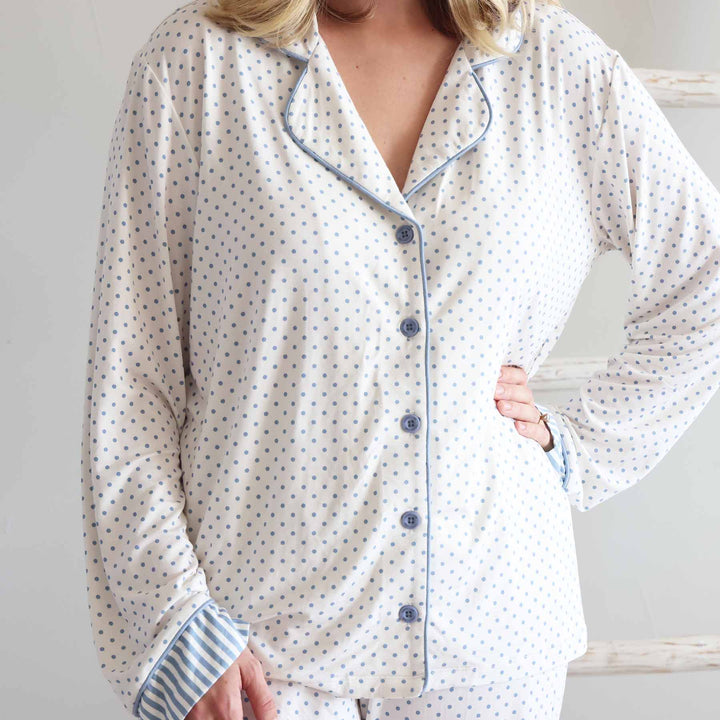 women's long sleeve flare lounge set with with blue polka dots with stripe detailing at the bottom of the sleeves 