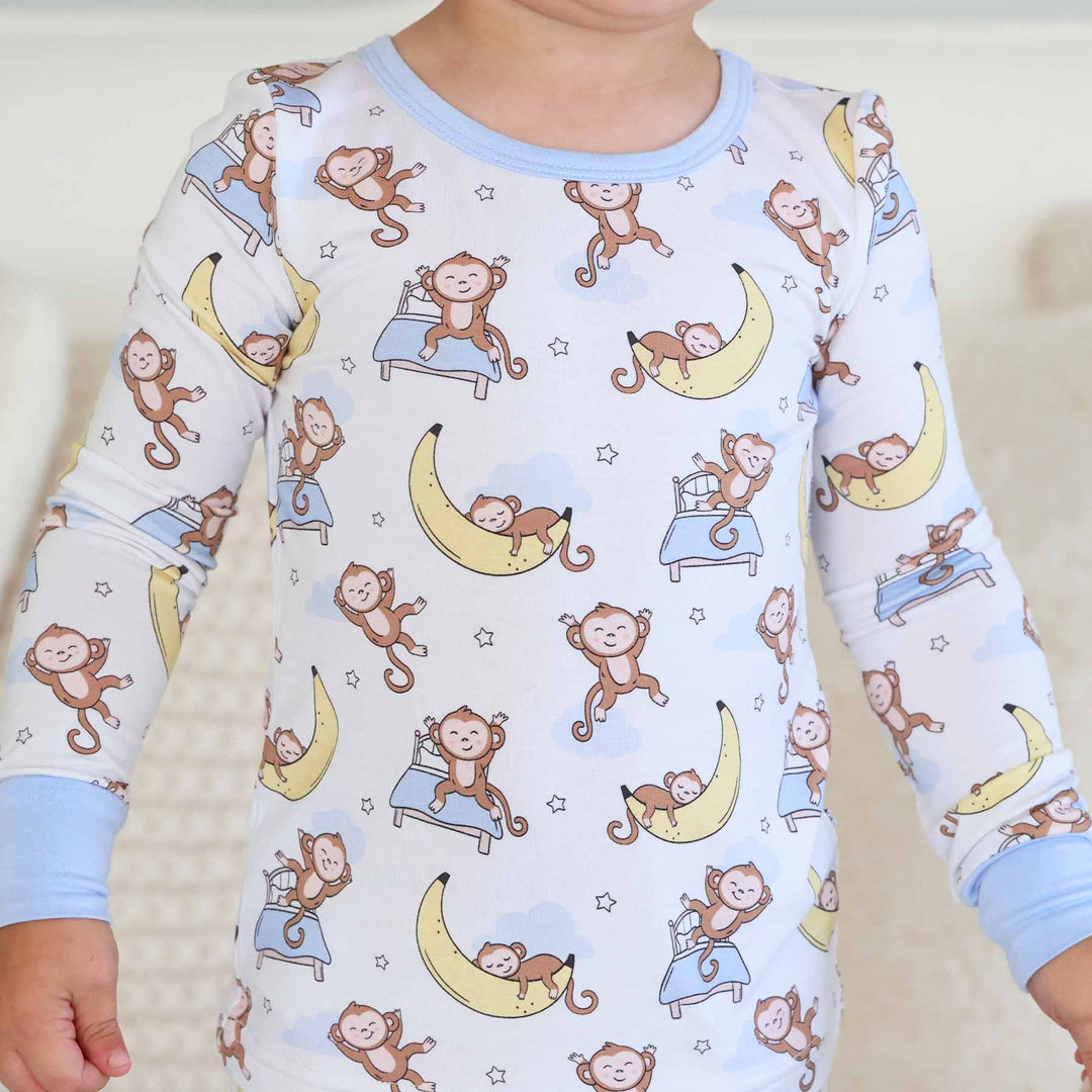 gender neutral sleeping money on banana two piece pajama set for kids made of bamboo viscose 