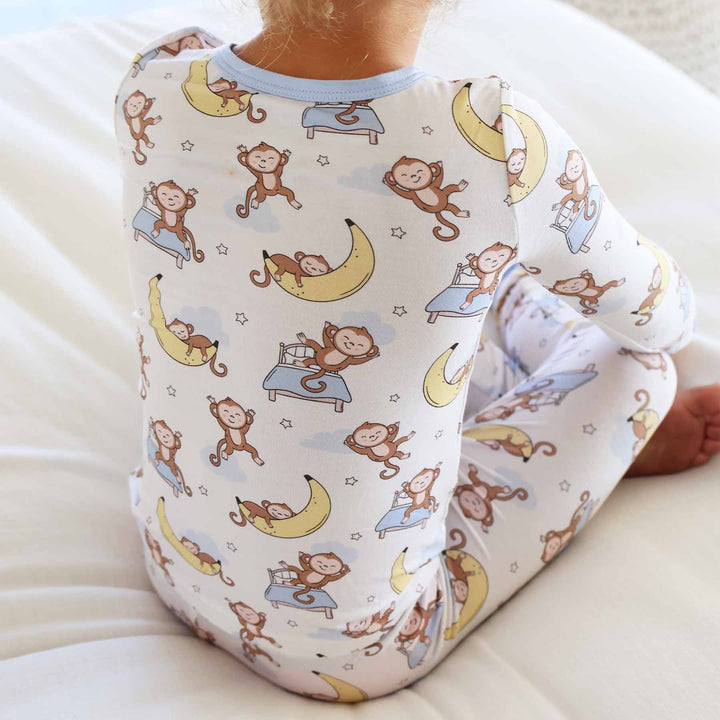 gender neutral sleeping monkey and banana two piece pajama set for kids 