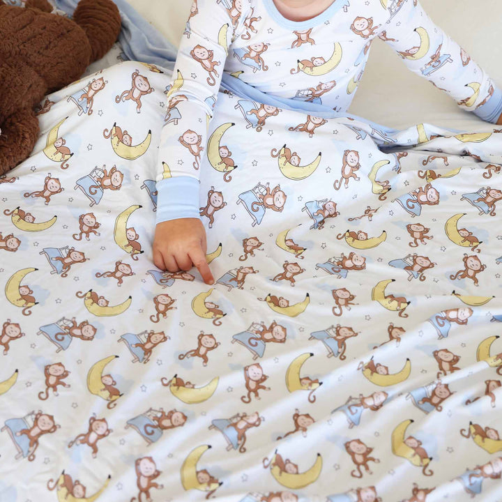 white, blue, yellow and brown sleeping money and banana two piece pajama set for kids gender neutral