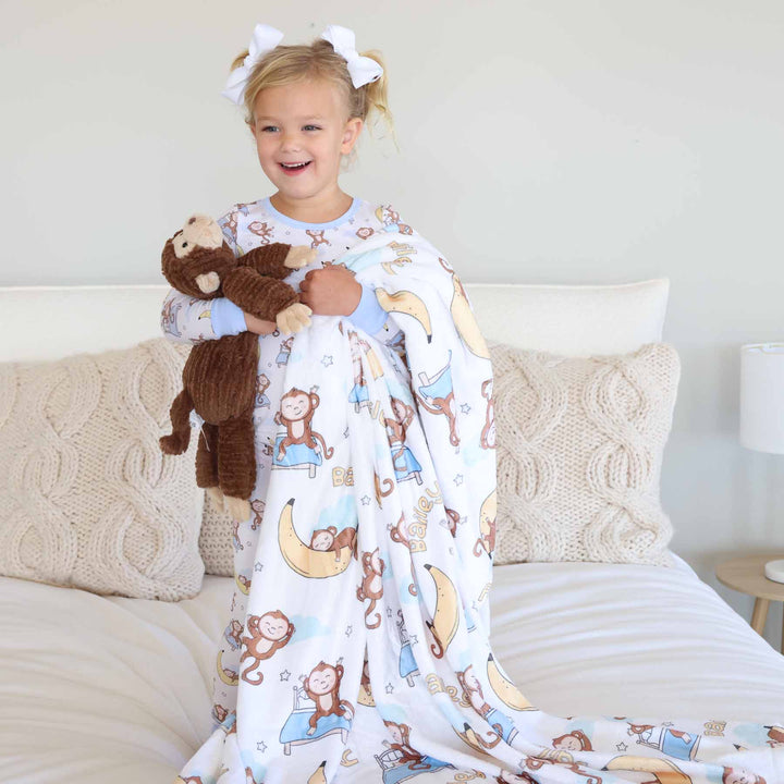 monkey, banana, and bed personalized blanket for kids with monkey stuffed animal