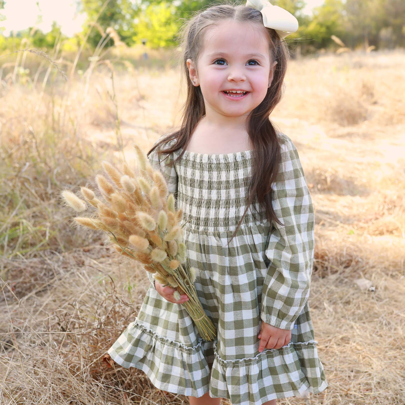 gingham dress with long sleeves and smocked top