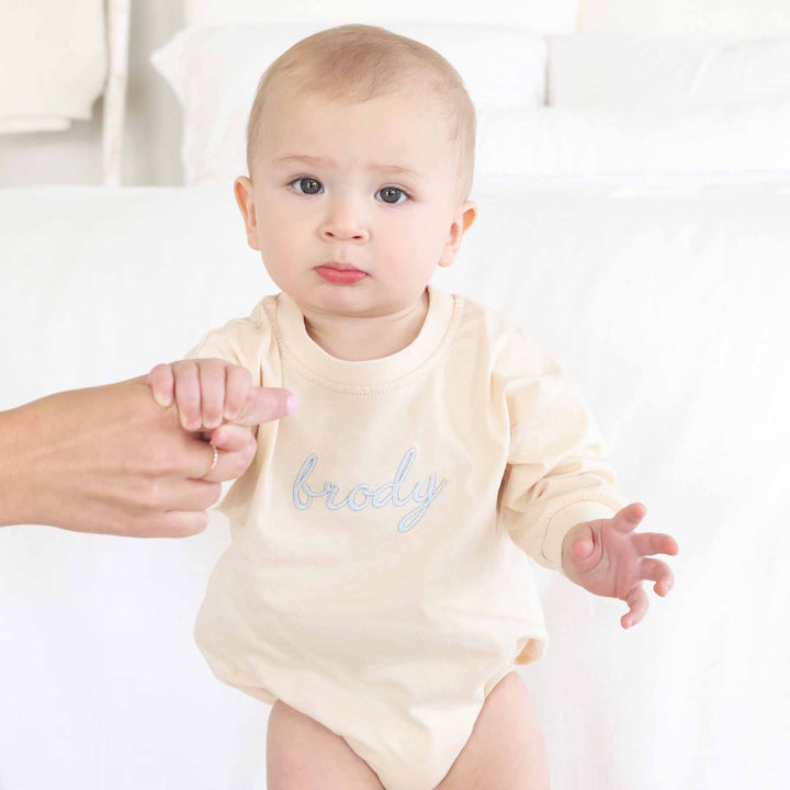 long sleeve embroidered baby romper natural tan color with light blue thread for boys 