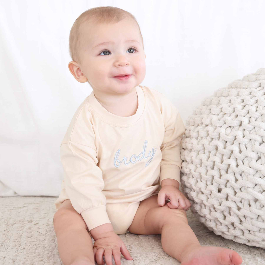 snap bottom long sleeve bubble romper for babies embroidered with name 