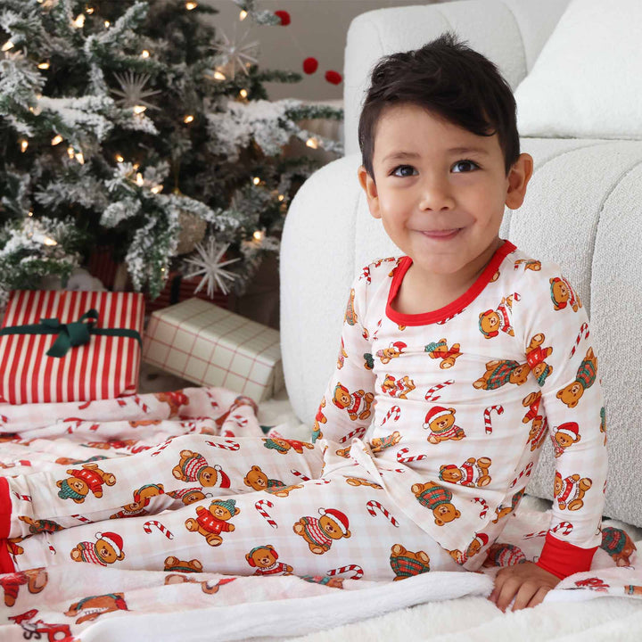 kids christmas pajamas with teddy bears wearing christmas sweaters and candy canes 