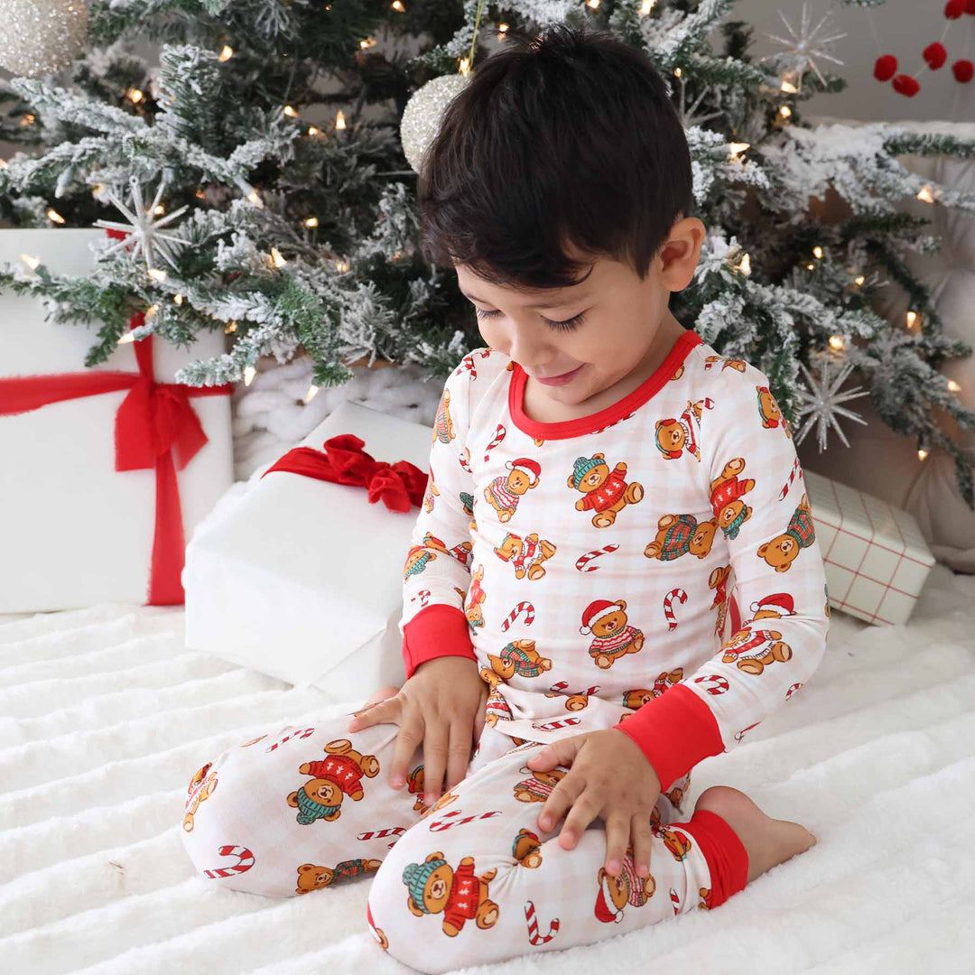 caden lane bamboo pajamas for kids with teddy bears wearing christmas sweaters sprinkled with candy canes 