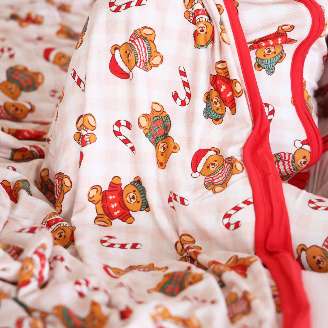 neutral gingham christmas teddy bear and candy cane bamboo blanket for kids with red reversible side 