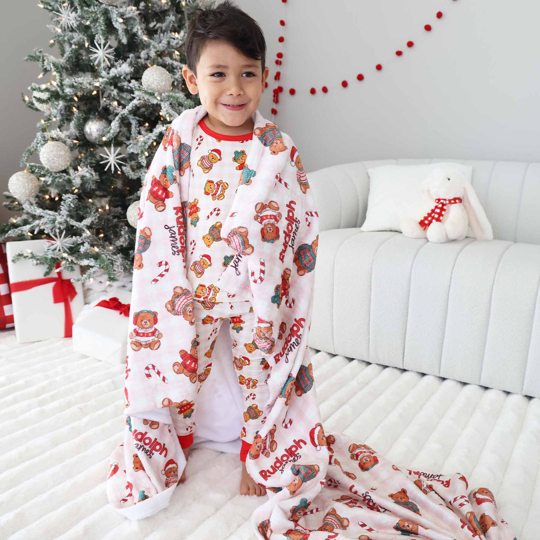 christmas blanket for kids personalized with name with teddy bears wearing christmas sweaters and santa hats 