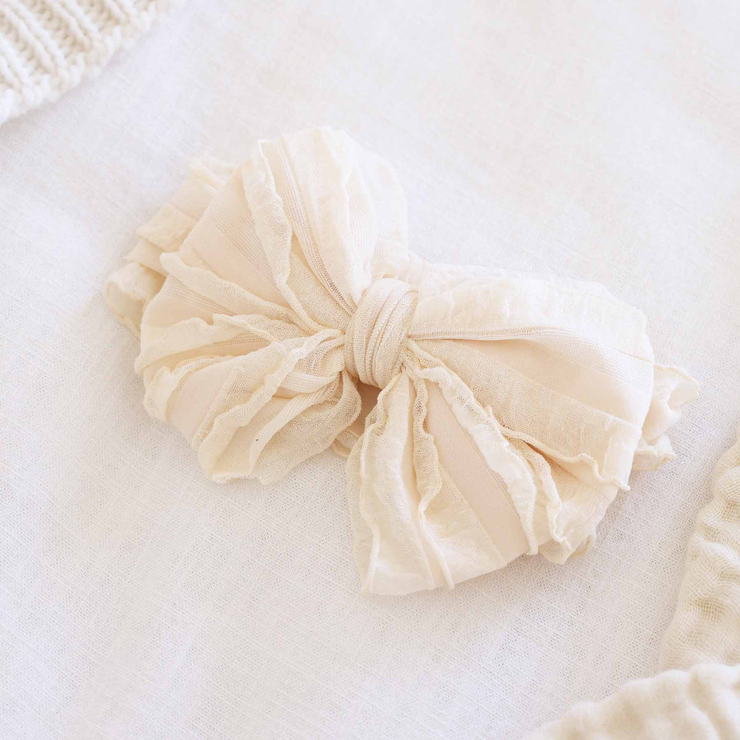 nude large ruffle knit bow 