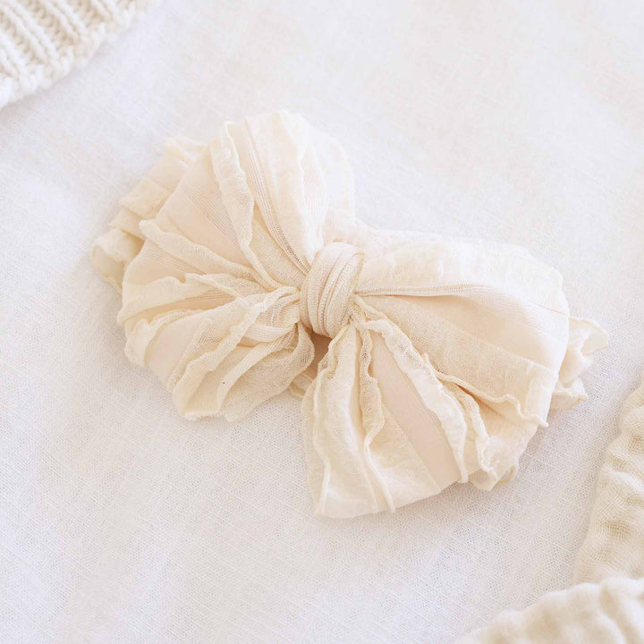 nude large ruffle knit bow 