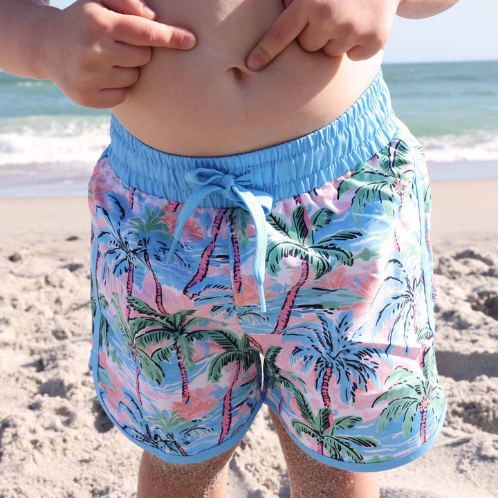 swim trunks for boys with pastel palm trees