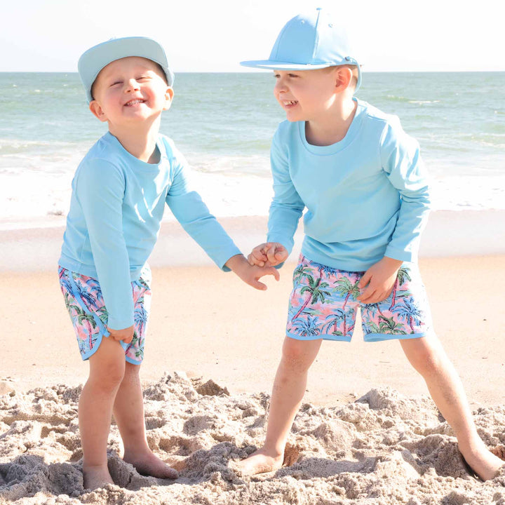 knee length boy's swim trunks with palm trees