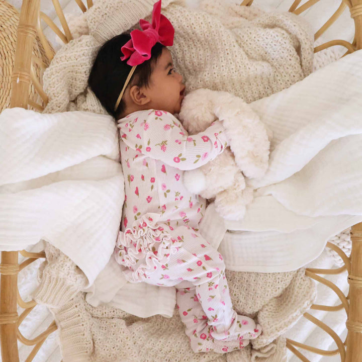 pink floral ruffle bottom footie for babies 