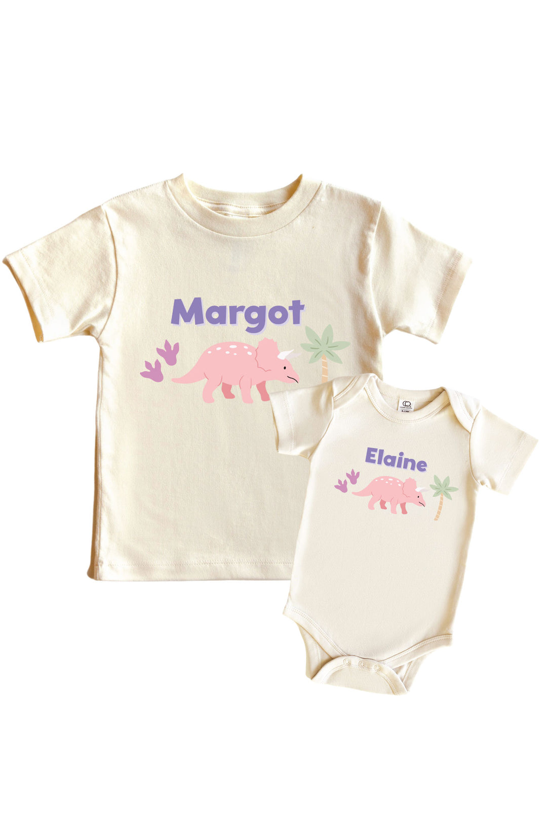Natural cream kids tee and baby bodysuit set featuring a pink triceratops dinosaur graphic with pastel plant accents and personalized name in purple lettering