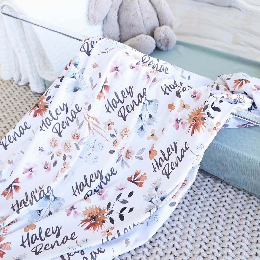 blue and orange floral personalized swaddle blanket 