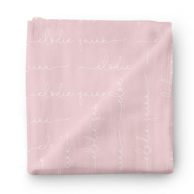 white on pink personalized baby name swaddle blanket script 