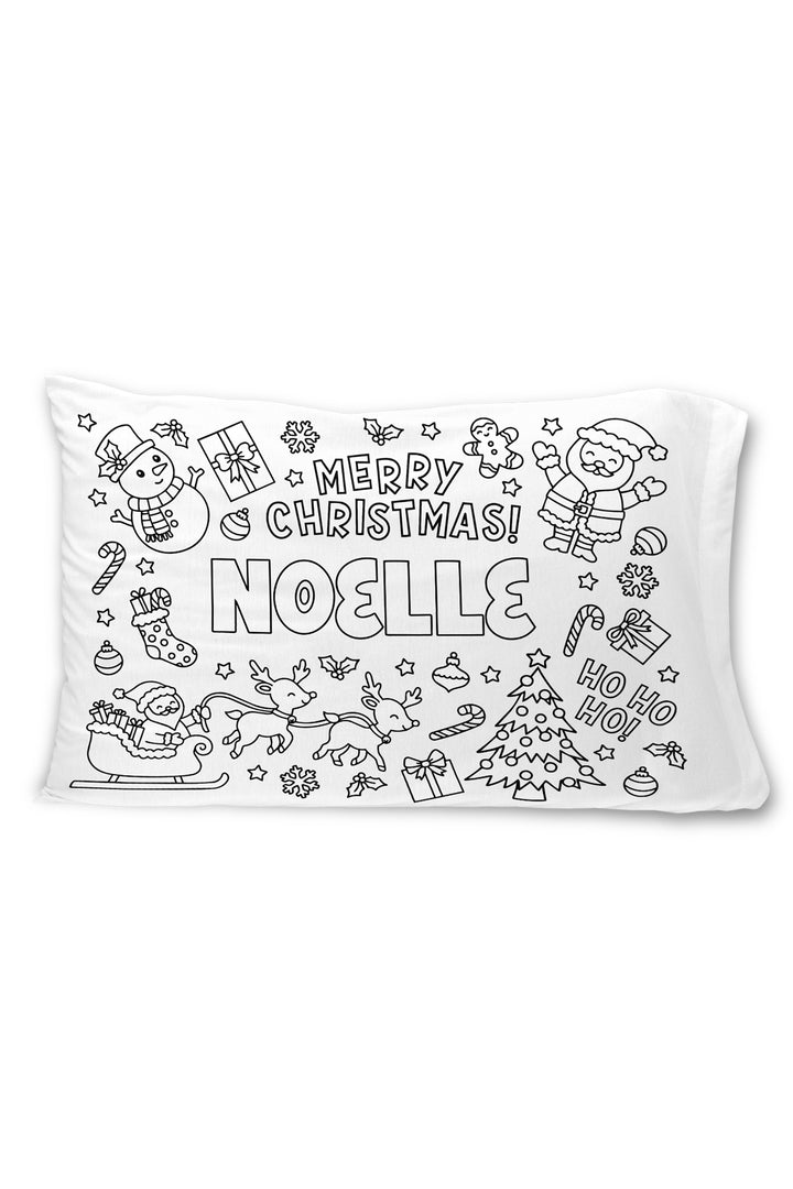 Caden Lane colorable pillowcase with the name "Noelle" surrounded by a "Merry Christmas" banner, Santa, snowman, reindeer sleigh, and holiday illustrations.