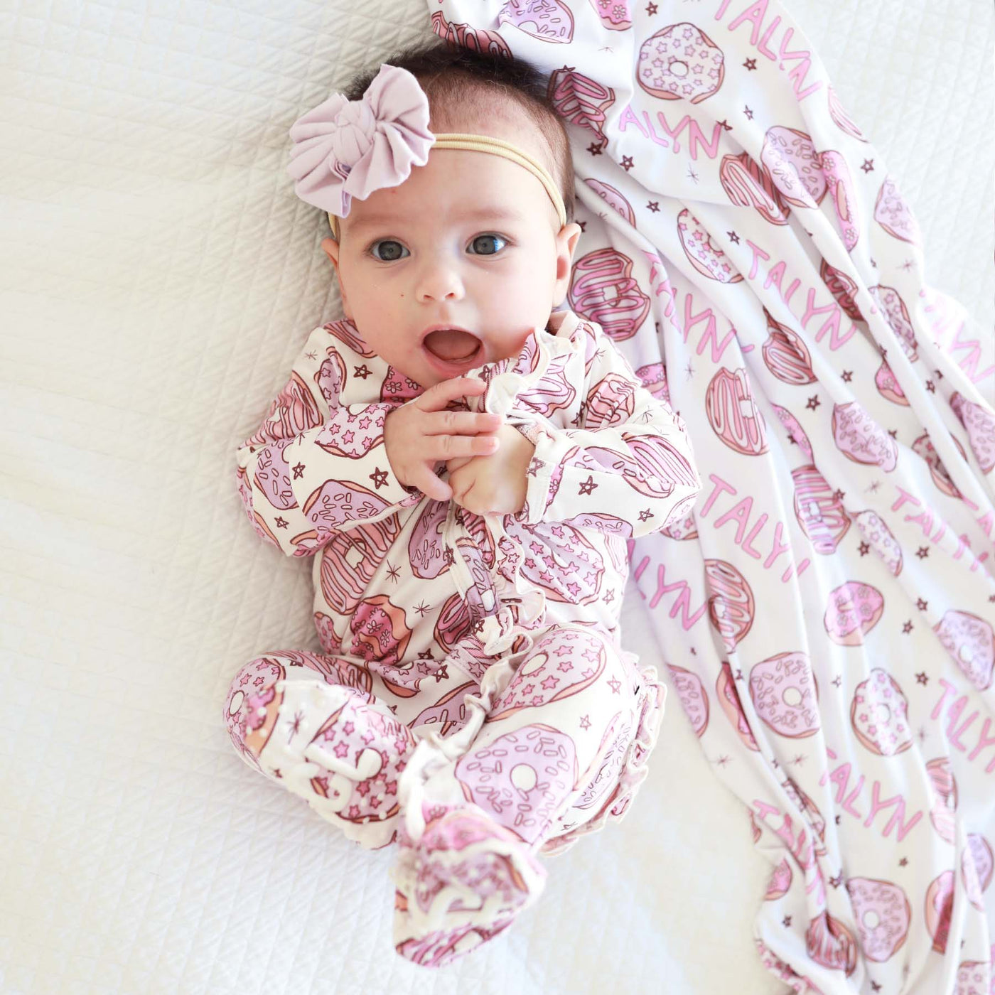 ruffle zipper footie with pink donuts 