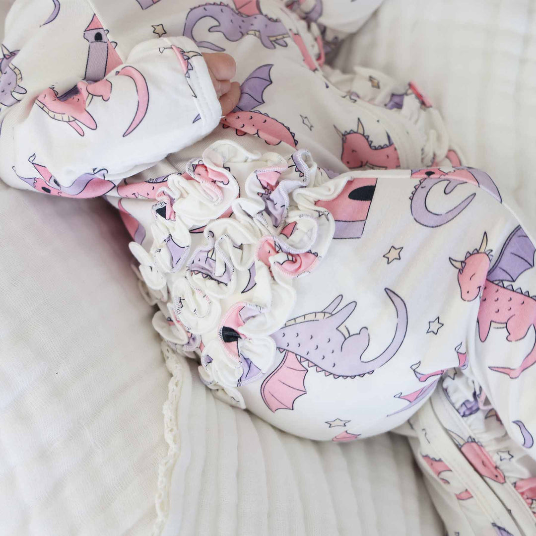 pink dragon adventure long sleeve ruffle bottom zipper footie for girls 