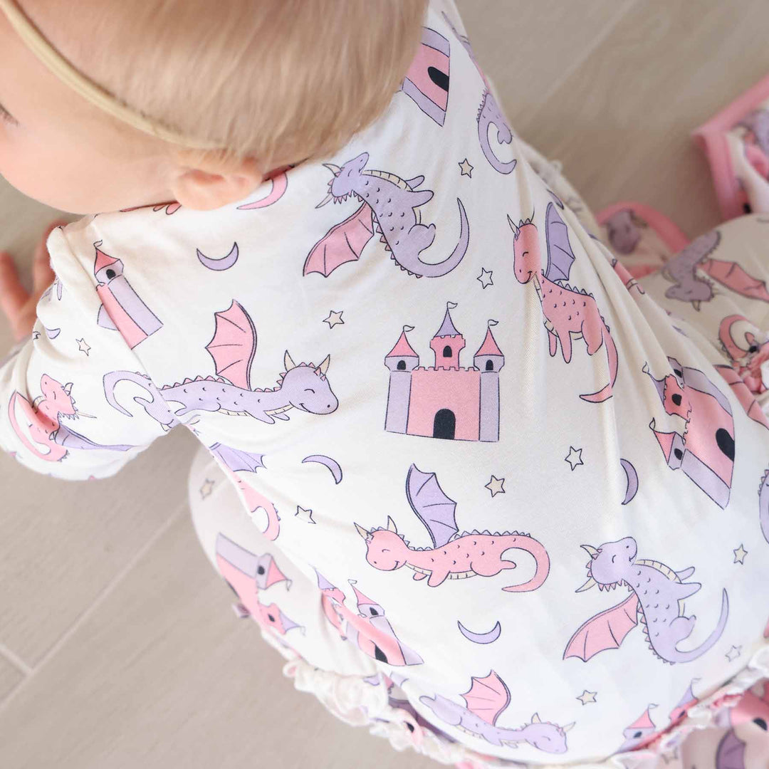 pink dragon adventure baby footie with ruffles 