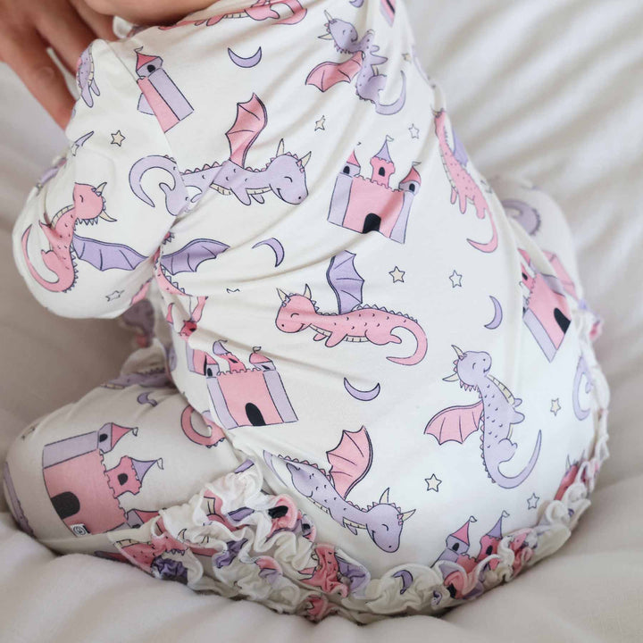 pink and purple dragon, castle, moon and star long sleeve zipper footie with ruffles 