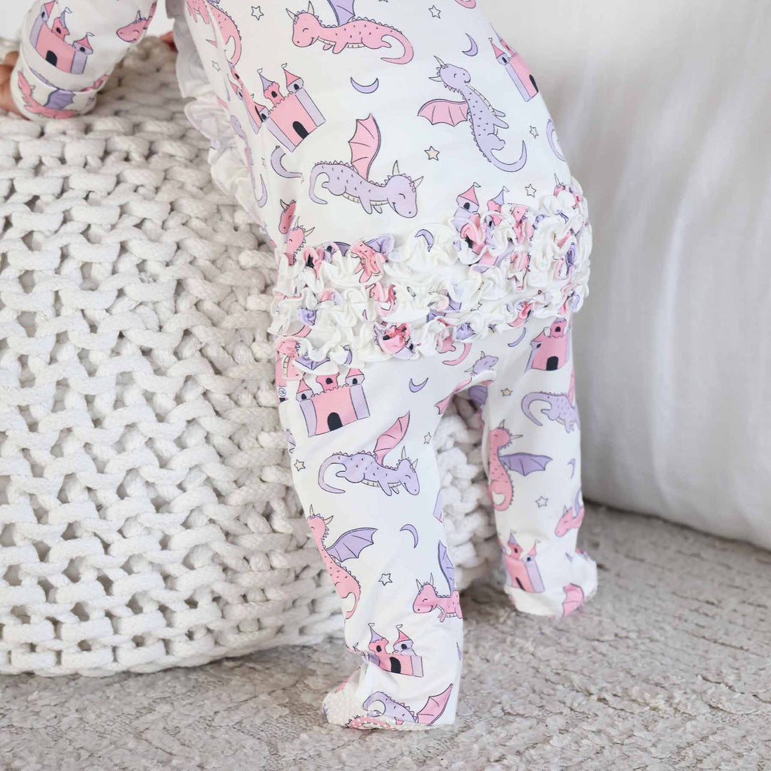 pink and purple dragon and castle ruffle bottom zipper footie for girls 