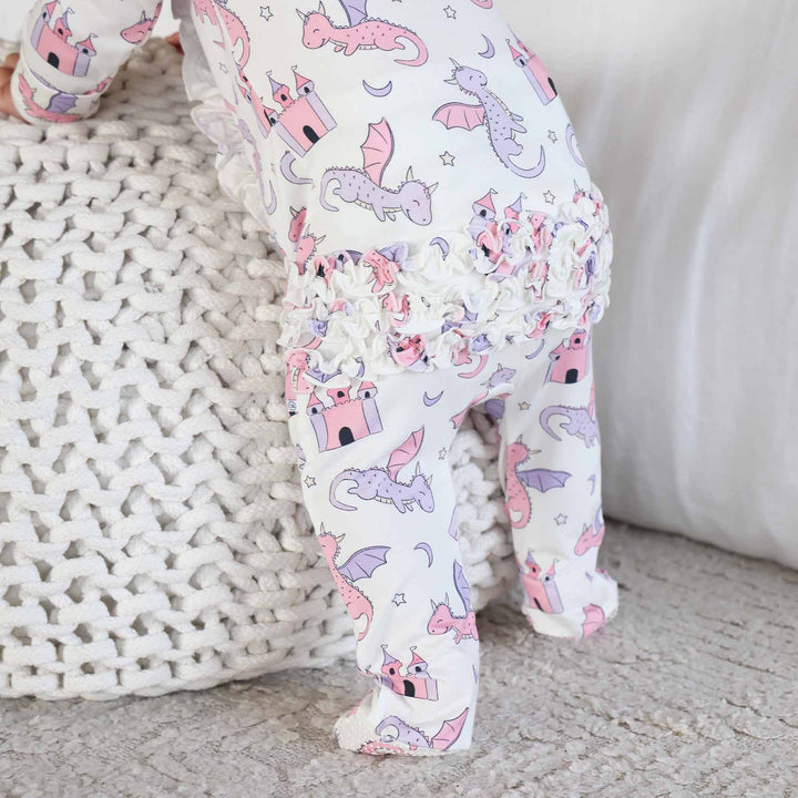 pink and purple dragon and castle ruffle bottom zipper footie for girls 