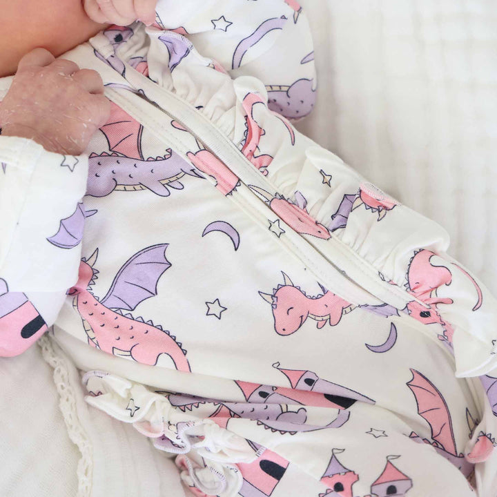 pink dragon adventure ruffle bottom zipper footie for baby girls 