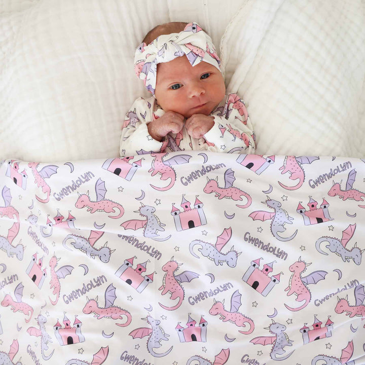 pink and purple dragon and castle personalized swaddle blanket for girls