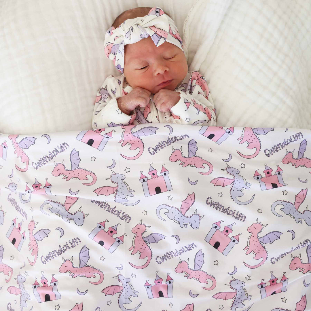 pink and purple dragon and castel personalized swaddle blanket for girls with moons and stars