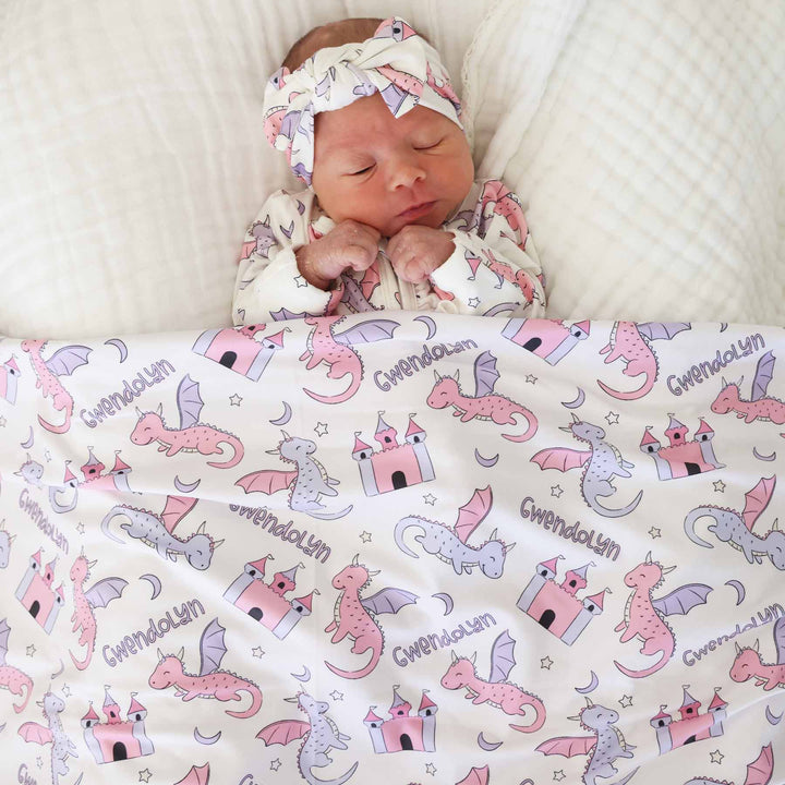 pink and purple dragon and castel personalized swaddle blanket for girls with moons and stars