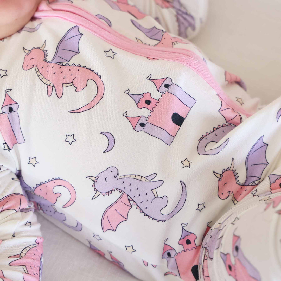 pink and purple fairytale themed convertible zip romper pajama for baby and toddler girls 