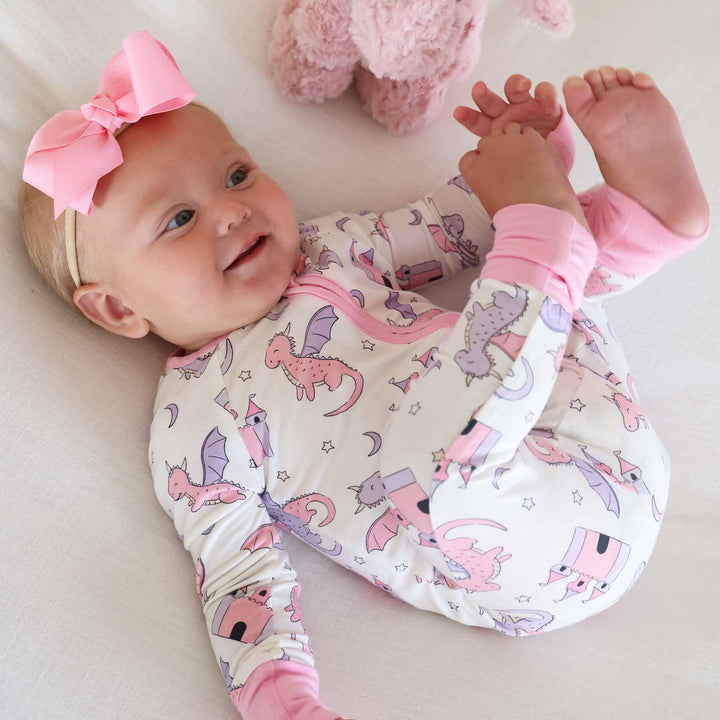 pink and purple dragon and castle convertible zip romper for girls with pink ribbon bow headband 
