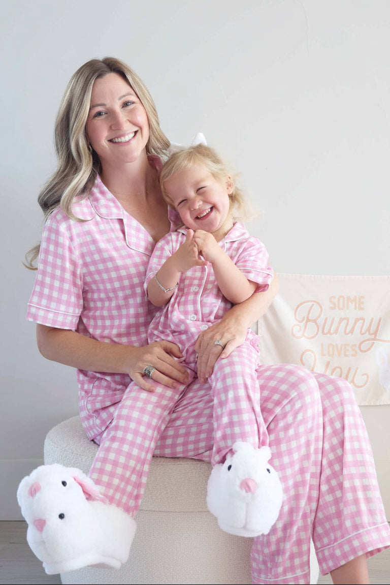 girl sitting on mom's lap in pink and white gingham lounge set with mom in matching set for easter 