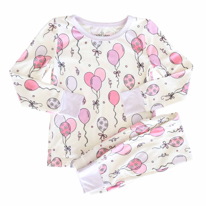 pink and purple floral accented balloons and streamer two piece long sleeve and pant pajama set for girls 