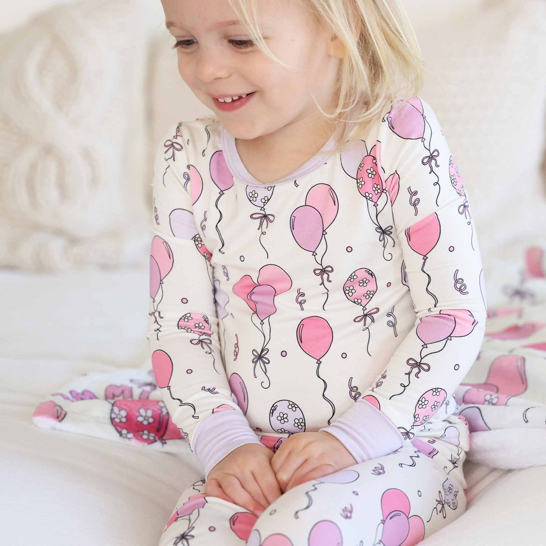 girls two piece pajama set with pink balloons and streamers