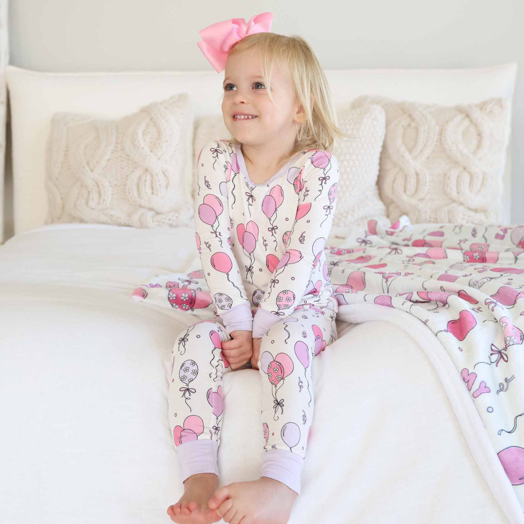 girls two piece pajama set with pink and purple balloons 