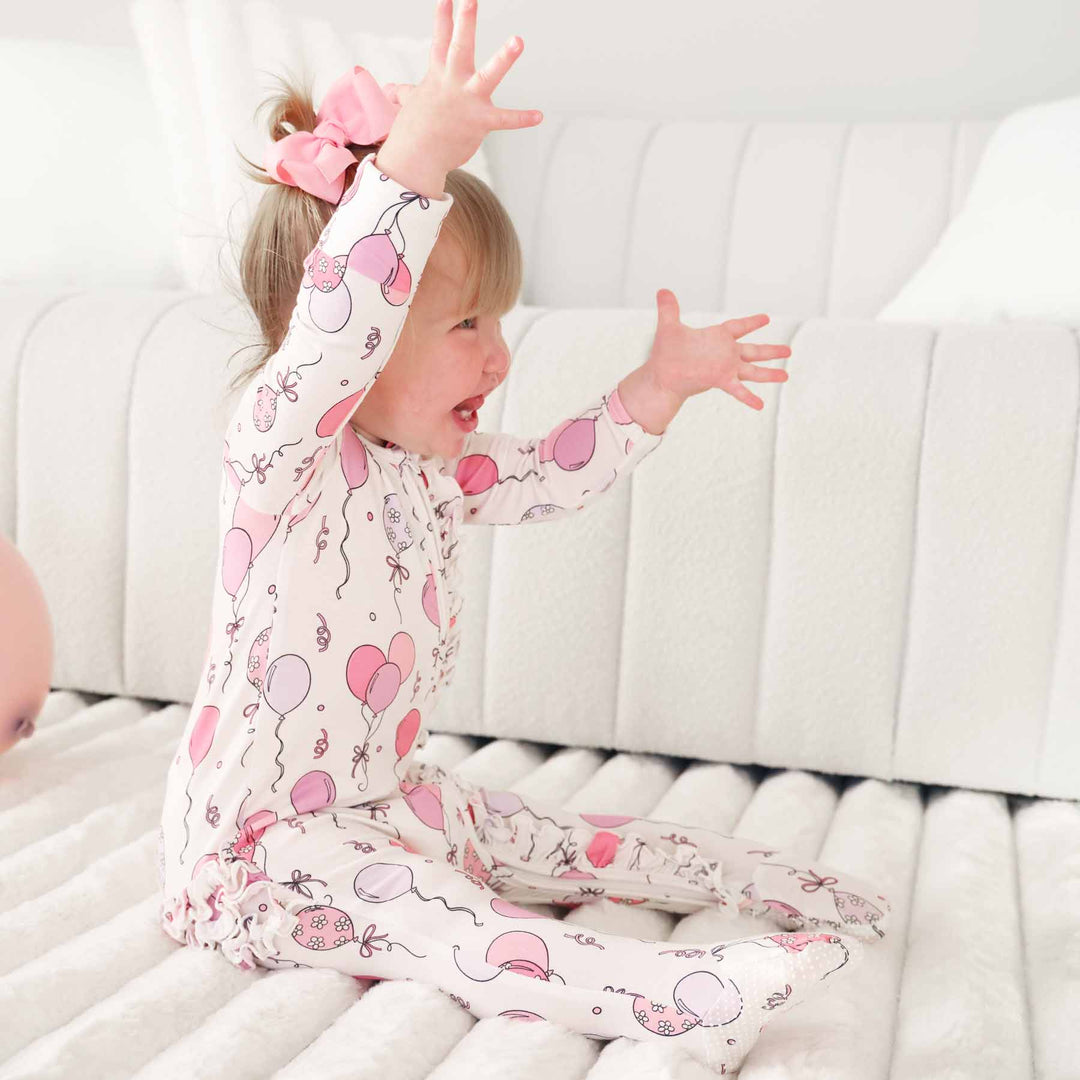 pink party time ruffle zipper footie 