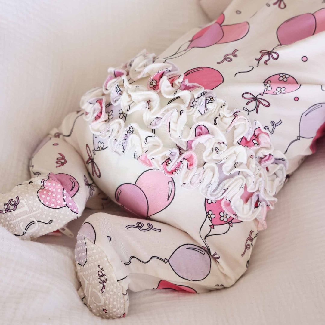 ruffle bottom pink and purple balloon and streamer birthday footie pajama for babies 