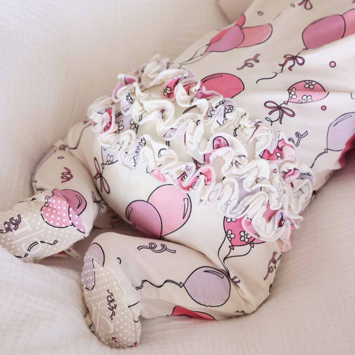 ruffle bottom pink and purple balloon and streamer birthday footie pajama for babies 