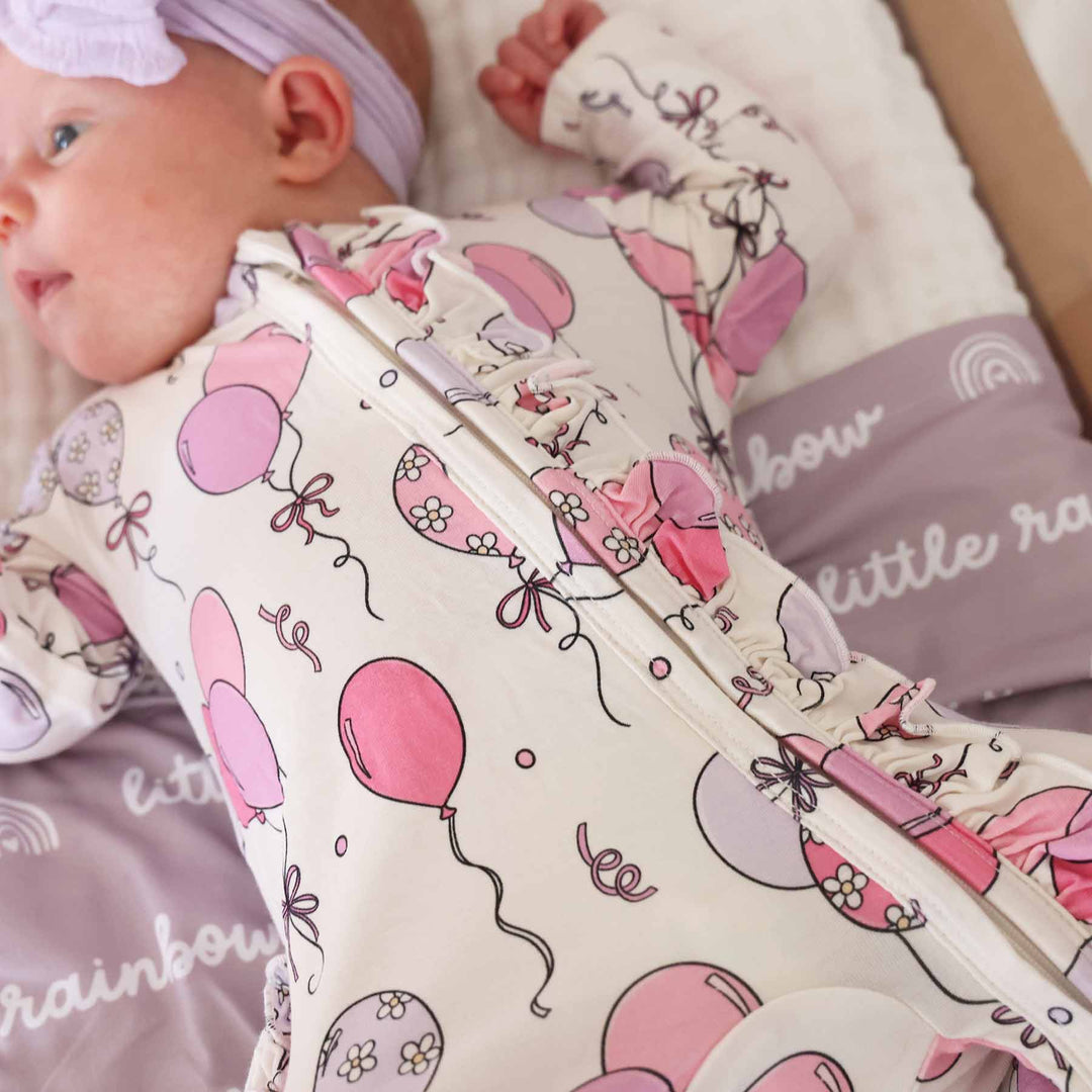 pink party time bamboo viscose ruffle zipper footie for baby girls 