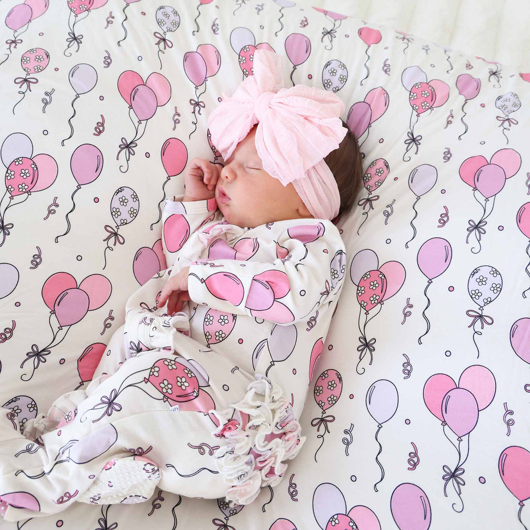 pink and purple balloon party themed footie pajama with ruffles for girls 