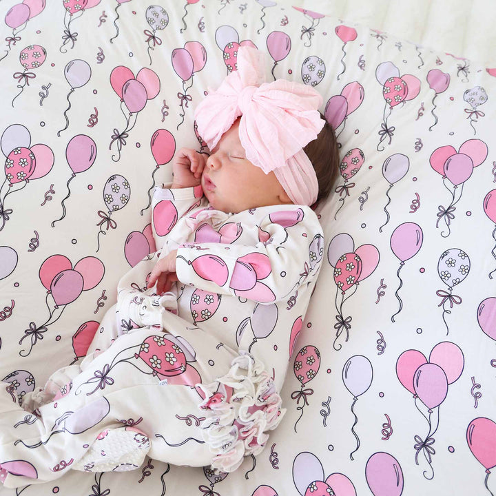 pink and purple balloon party themed footie pajama with ruffles for girls 