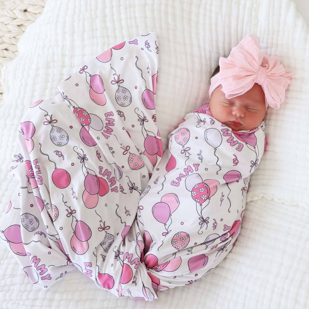 girl's party-themed personalized swaddle blanket with balloons 