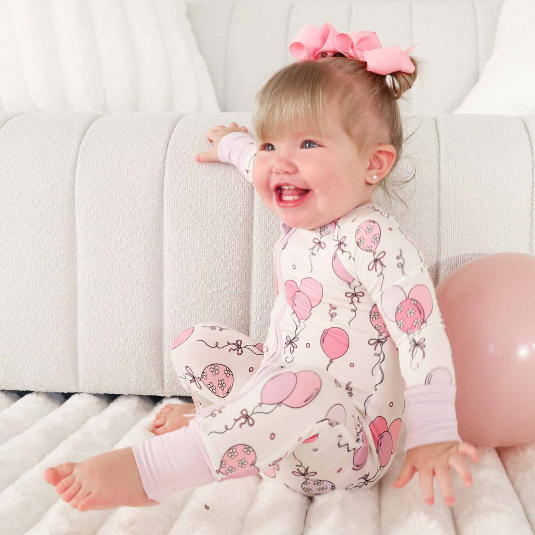 pink convertible zip romper pajama for baby and toddler girls